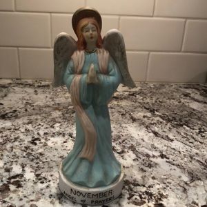 Angel of Prayers statue representing November